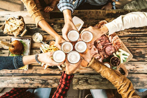 SMfriends-cheering-beer-glasses-on-wooden-table-cove-2023-11-27-05-01-39-utc.jpg__PID:970858d5-ad57-45f5-a52d-8ecee201e39d